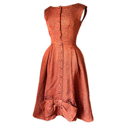 Burnt orange and gold brocade 1950s cocktail gown with button trimmed bodice