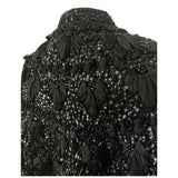 Bead and sequin embellished 1950s black wool capelet with interlaced ribbon