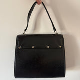 Black patent 1960s mod vintage handbag with abstract buckle detail