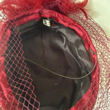 Claret satin vintage pillbox hat with mesh veil and feather trim