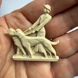 Art deco 1930s/40s celluloid lady walking dogs brooch