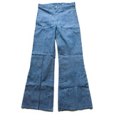 Pair of blue vintage flared jeans on a white background