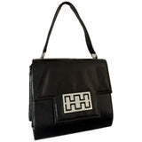 Black patent 1960s mod vintage handbag with abstract buckle detail