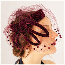 Dramatic 1950s burgundy velvet sculpted vintage halo cocktail hat with veil